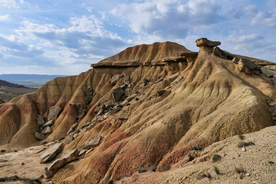 Eroded sandstone formations in the arid Spanish desert under blue sky