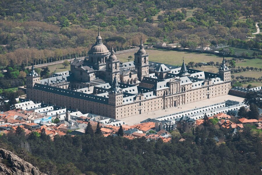 Aerial view of El Escorial Monastery from above showing the full scale of the complex