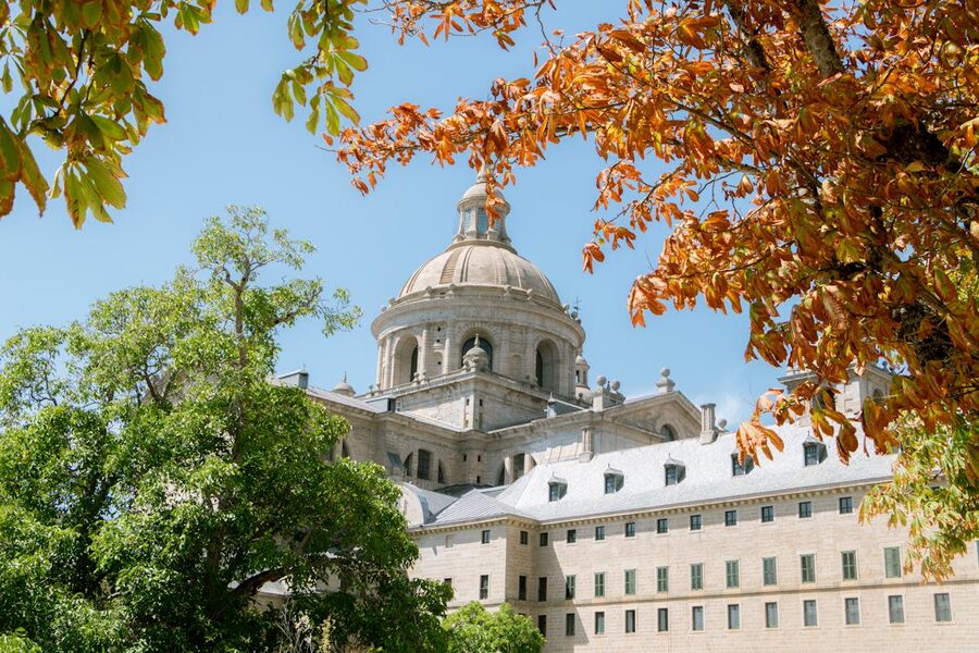 El Escorial monastery with autumn trees in the foreground