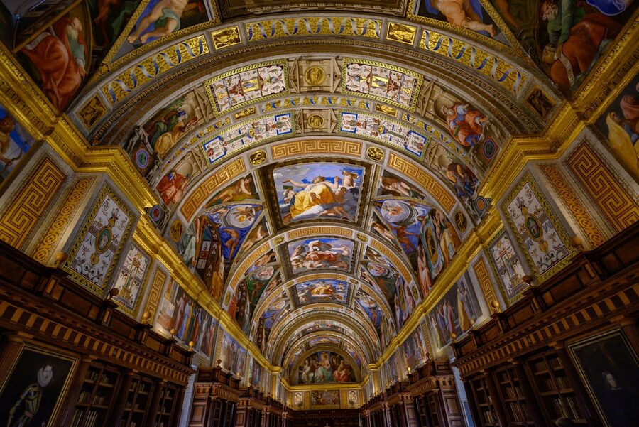 El Escorial Library painted ceiling with ornate frescoes and arched architecture