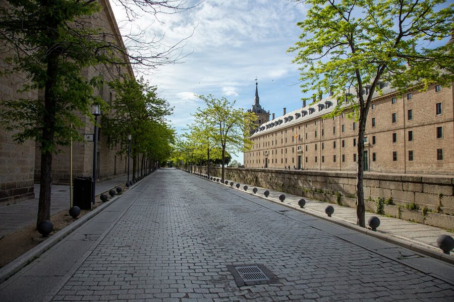 Tree-lined street in San Lorenzo de El Escorial town near the monastery