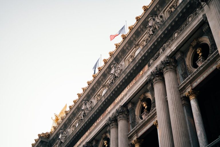 The ornate Neo-Baroque facade of the Palais Garnier opera house in Paris