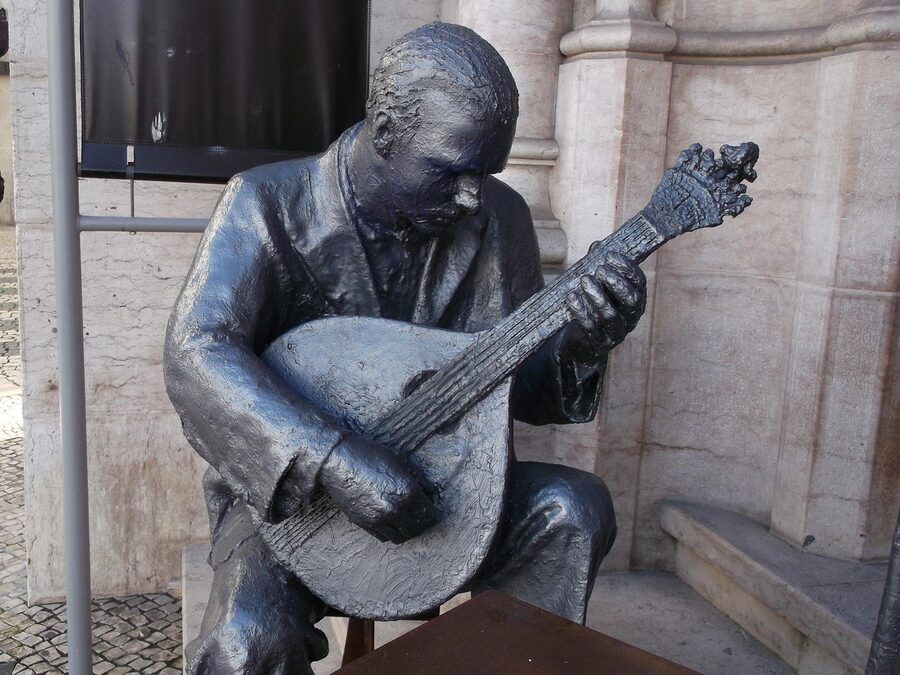Statue of fado singer with Portuguese guitar, Lisbon