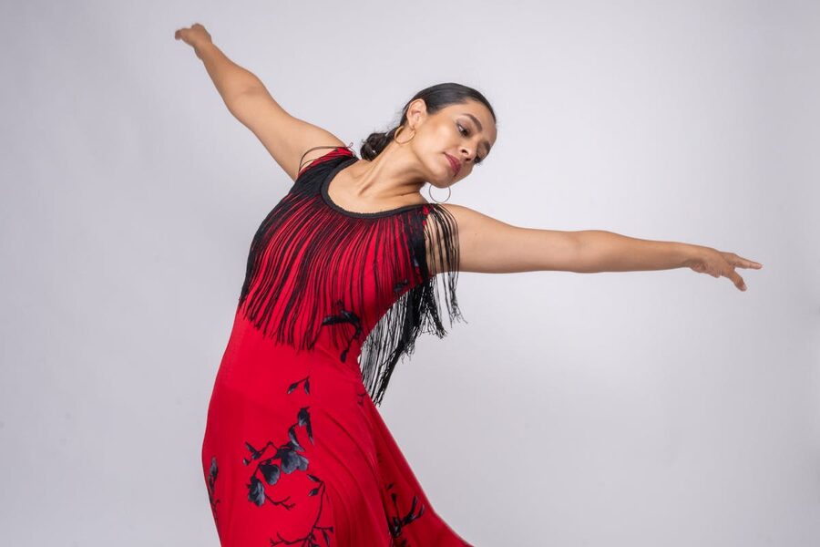 Flamenco dancer captured mid-performance in red