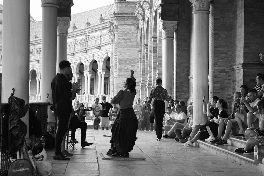 Traditional flamenco dancers performing at Plaza de Espana in Seville, Spain