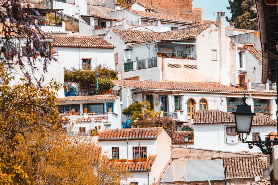 Whitewashed Andalusian buildings with colourful accents in Granada, Spain