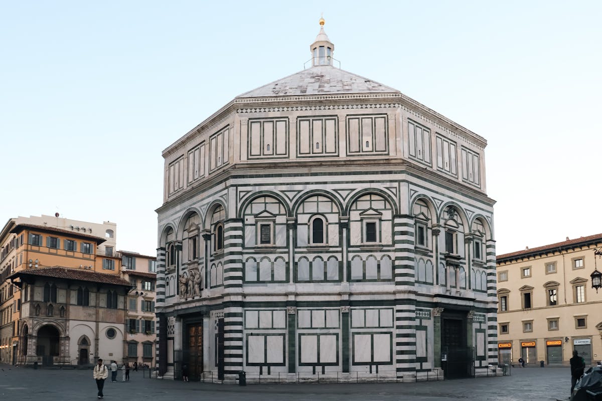 The Florence Baptistery of San Giovanni showing its distinctive octagonal shape and green and white marble exterior