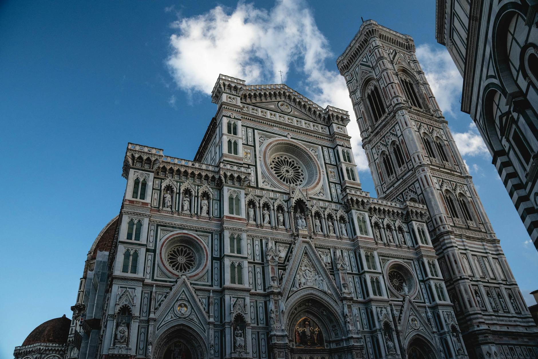 Florence Cathedral Santa Maria del Fiore facade and bell tower under blue sky