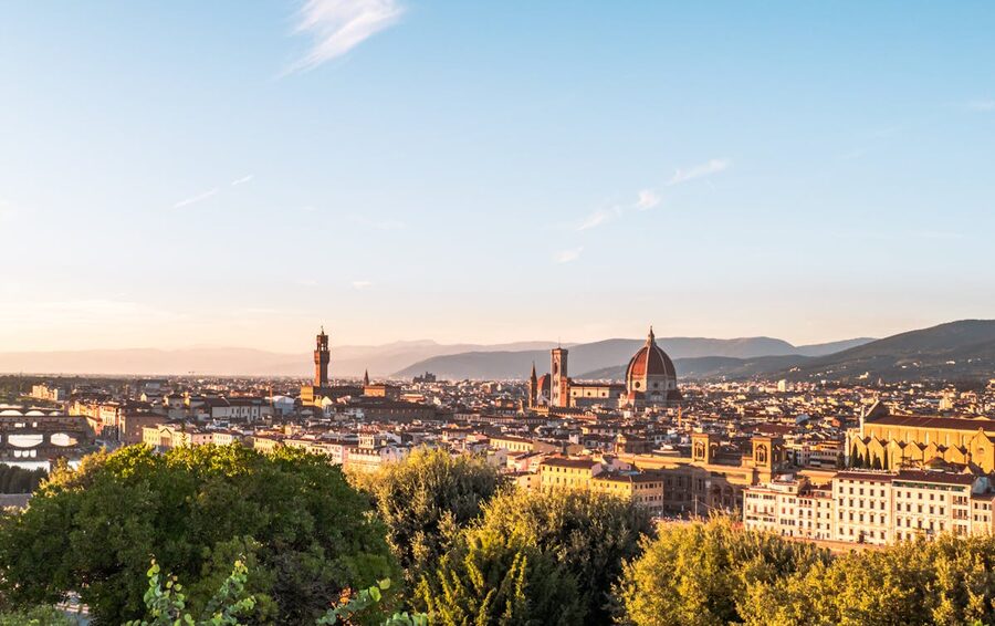 Florence skyline at sunset showing the Duomo cathedral dome and terracotta rooftops