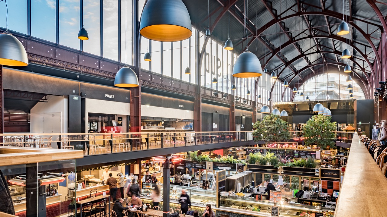 Interior of a covered food market in Nice with vegetable and food stalls