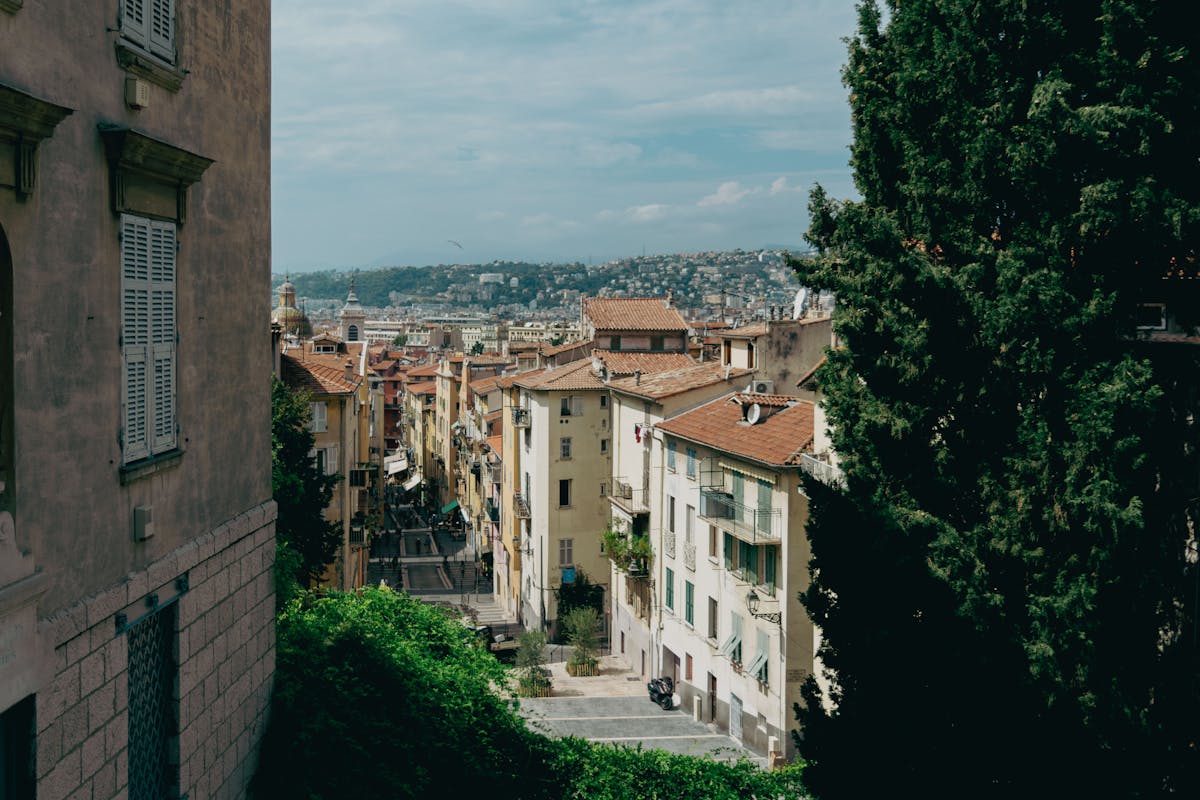 Picturesque streets of Nice old town with historic architecture and hillside views