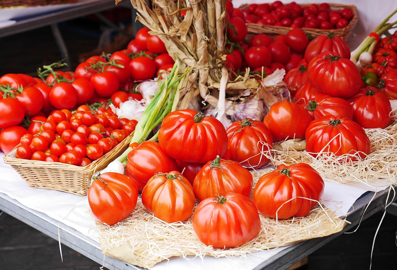 Fresh ripe tomatoes and vegetables at a market stall in Nice south of France