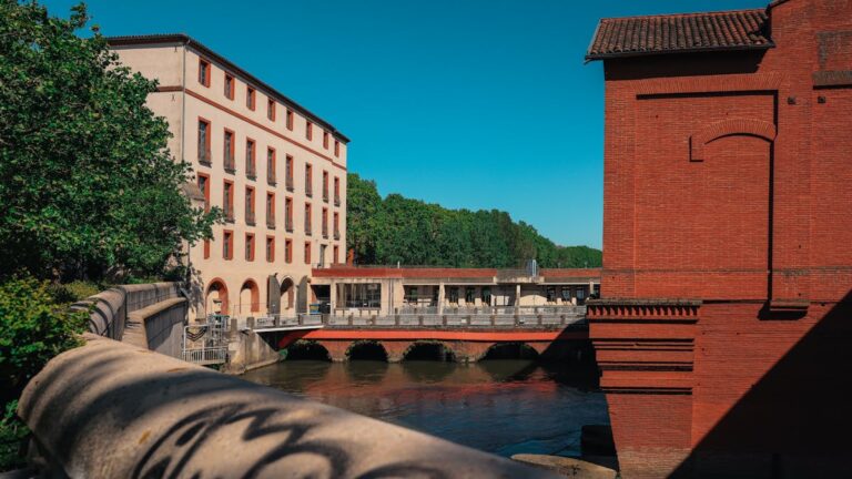 Pink brick buildings along the Garonne River in Toulouse France