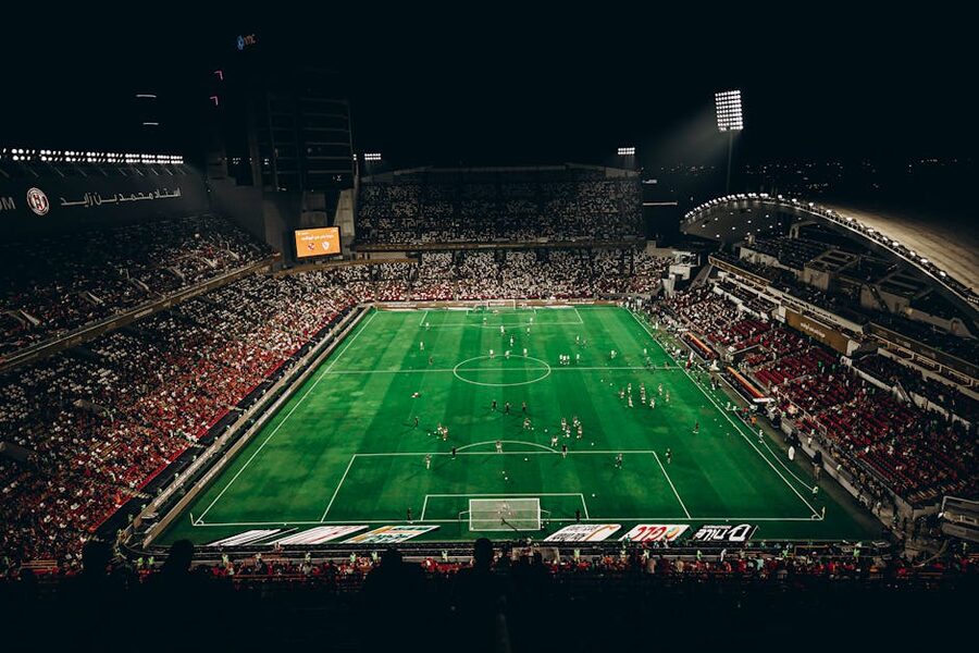 Football match at night with fans