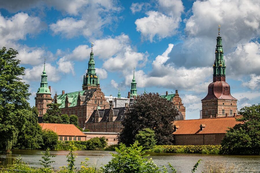 Frederiksborg Castle lake reflection surrounded by trees