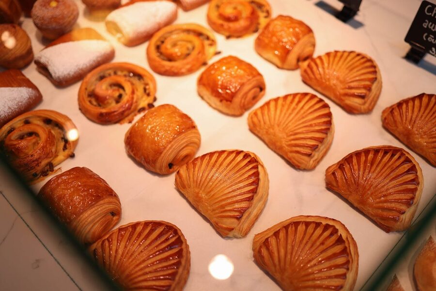 Array of freshly baked French pastries including croissants and pain au chocolat
