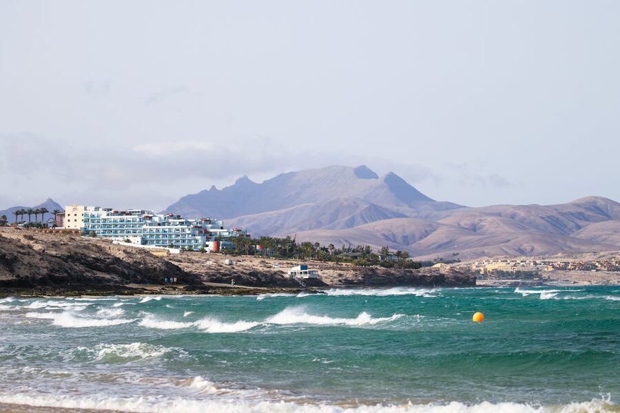 Fuerteventura coastline with waves and mountains at Costa Calma