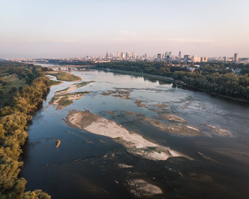 Aerial view of Vistula river meandering through Warsaw at sunset