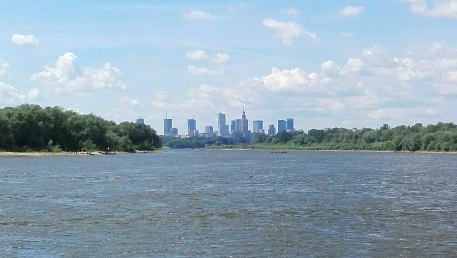 Warsaw skyscrapers and skyline seen from a boat on the Vistula