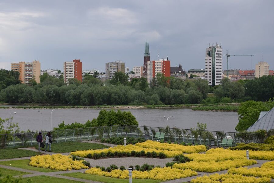 Warsaw skyline across the Vistula seen from a riverside garden