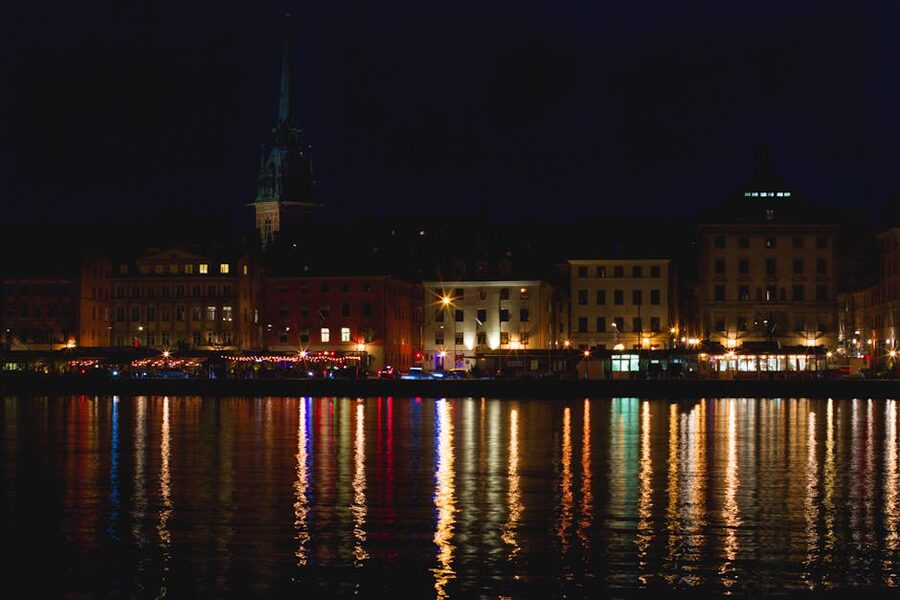 Stockholm Gamla Stan illuminated waterfront at night reflected in the water