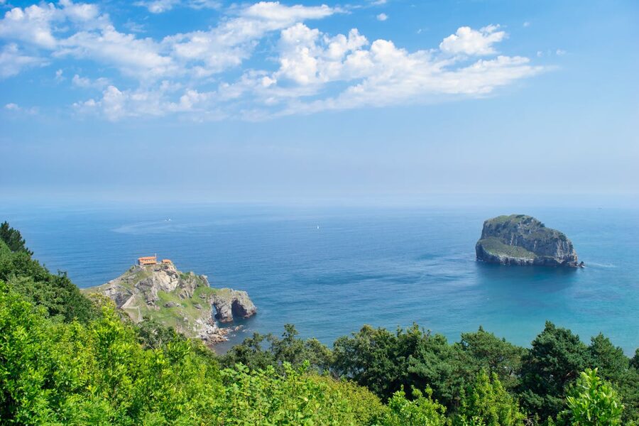 Aerial view of the island hermitage of San Juan de Gaztelugatxe connected to the Basque coast by a stone bridge