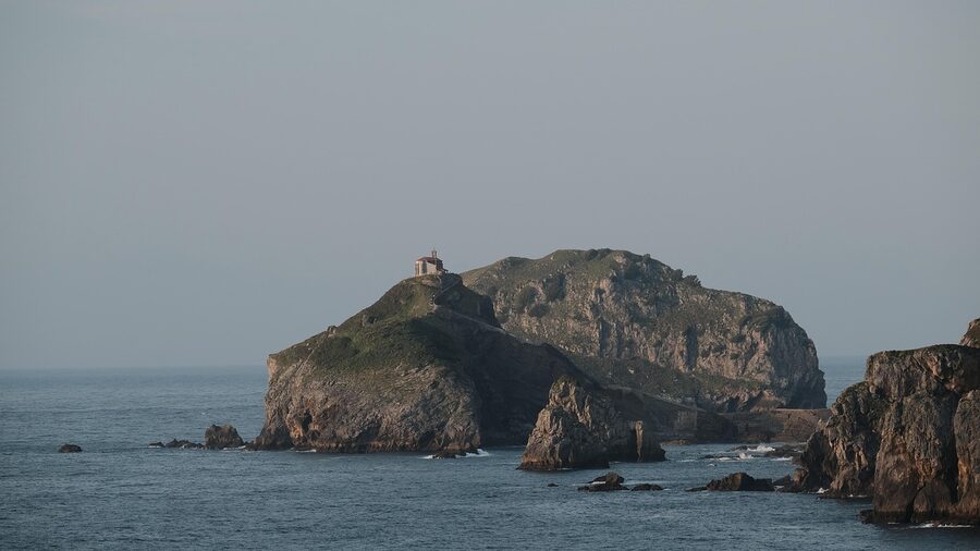 San Juan de Gaztelugatxe rocky island seen from the water with dramatic cliffs