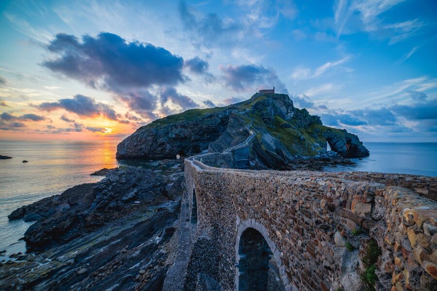Sunset over the coastal pathway leading to Gaztelugatxe in Spain