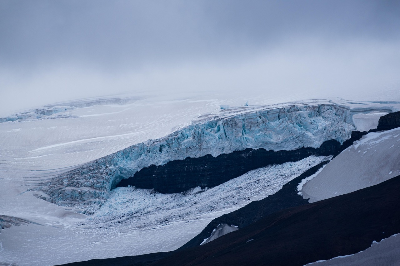 Snowmobile parked on a glacier in Iceland with vast white landscape