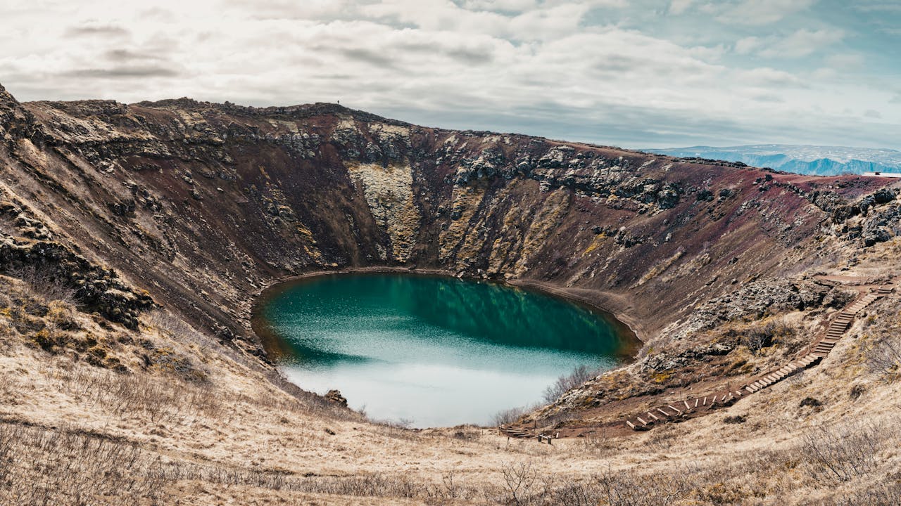 Kerid volcanic crater with blue lake in Iceland landscape from above