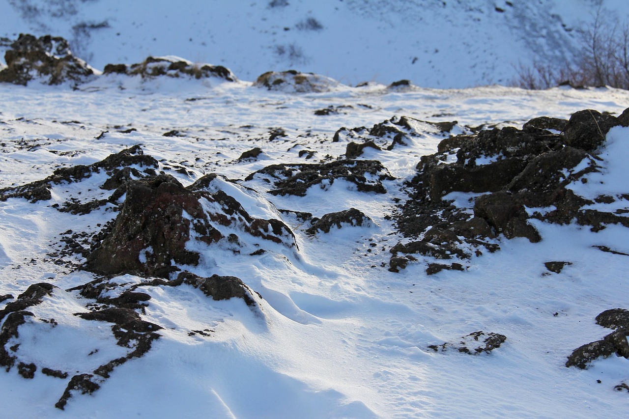 Kerid volcanic crater lake frozen in winter covered with snow Iceland