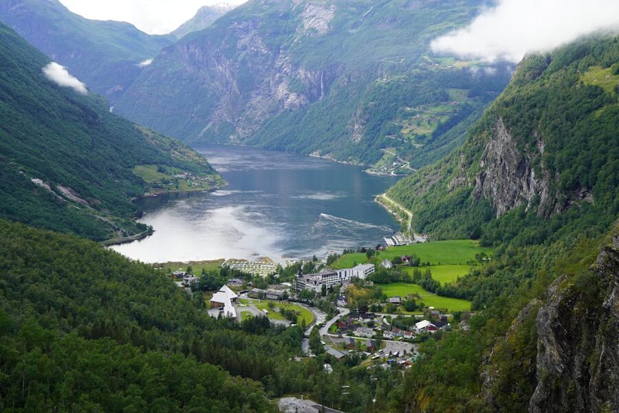 Aerial view of Geiranger Fjord with lush greenery and water