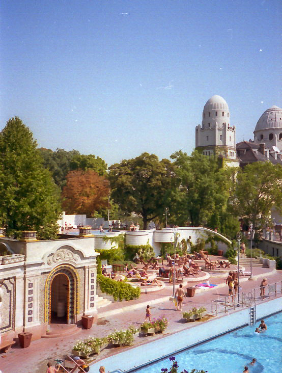 Outdoor pool at Gellért Spa Budapest with sunbathers in summer