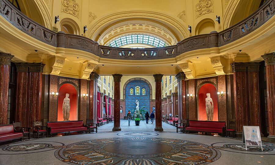 Indoor thermal pool hall at Gellért Spa Budapest with arched ceiling
