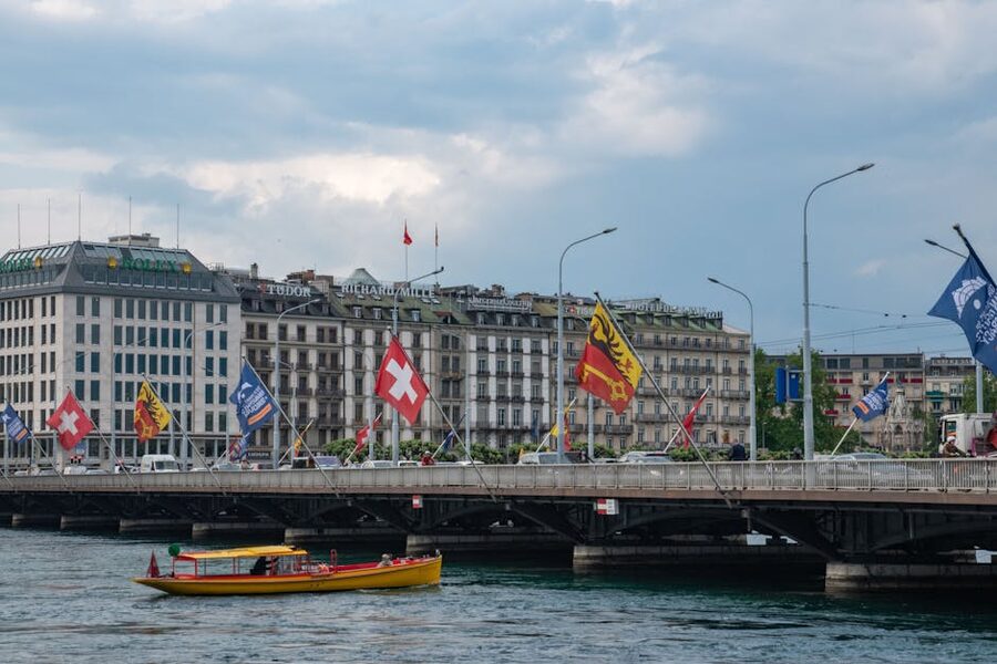 Mont Blanc Bridge Geneva Switzerland with flags