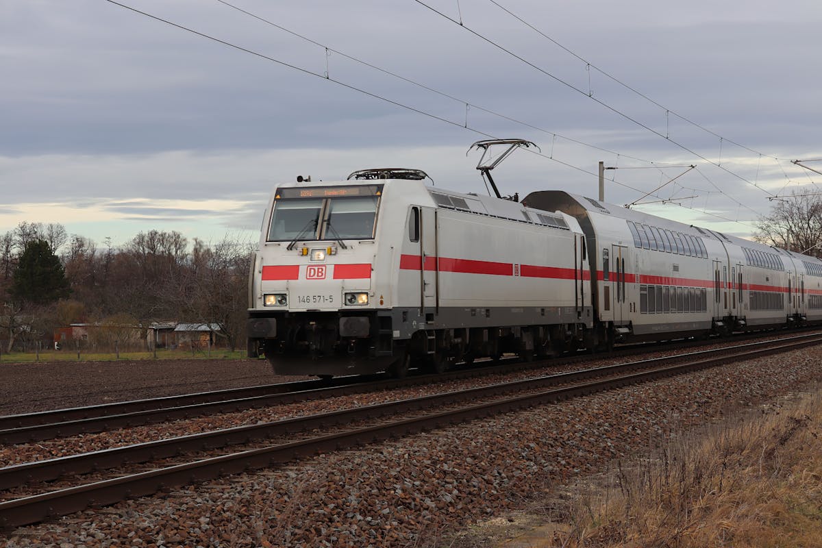 A DB regional train cutting through green German countryside on its way south