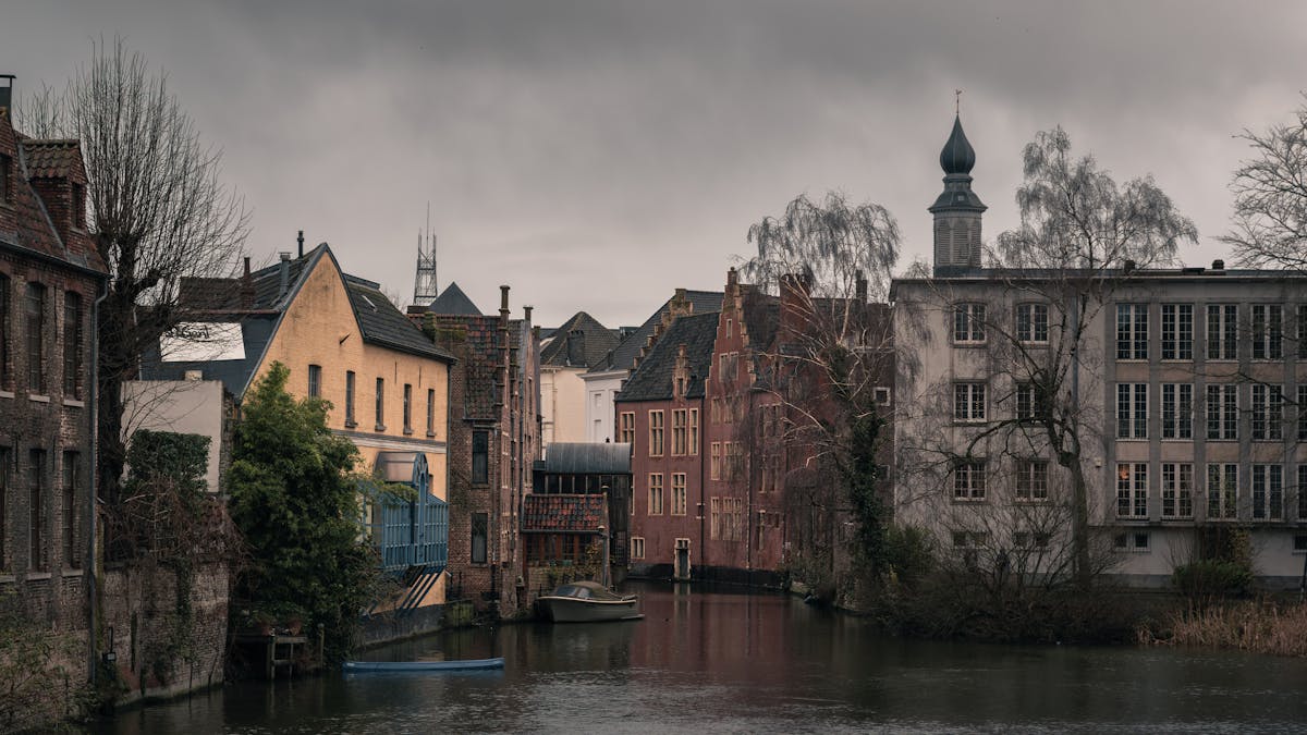 Historic canal and old town architecture in Ghent Belgium