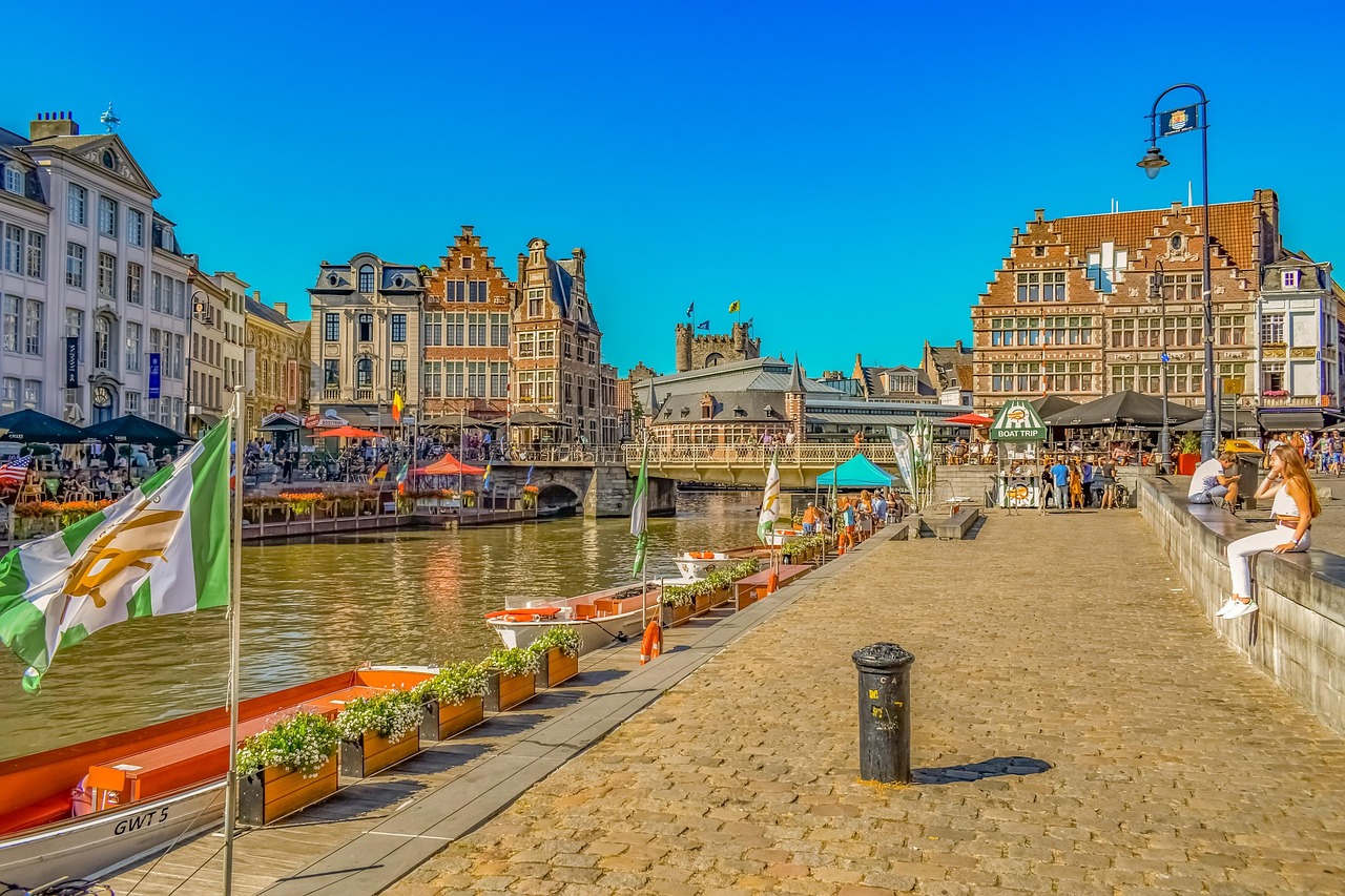 Canal promenade with historic buildings in Ghent Belgium