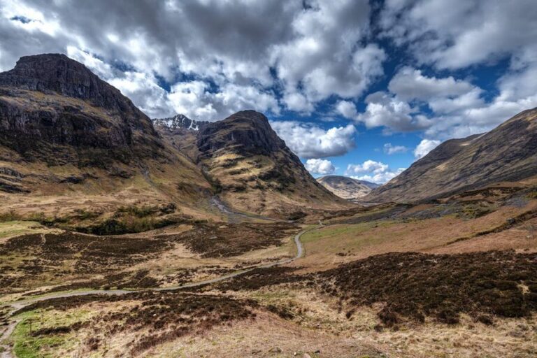 The sweeping valley of Glencoe in the Scottish Highlands under dramatic skies