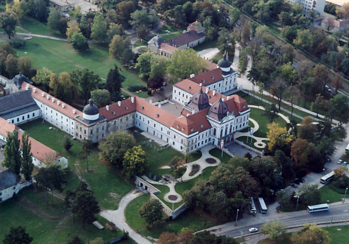 Yellow baroque facade of Gödöllő Palace from a wider angle