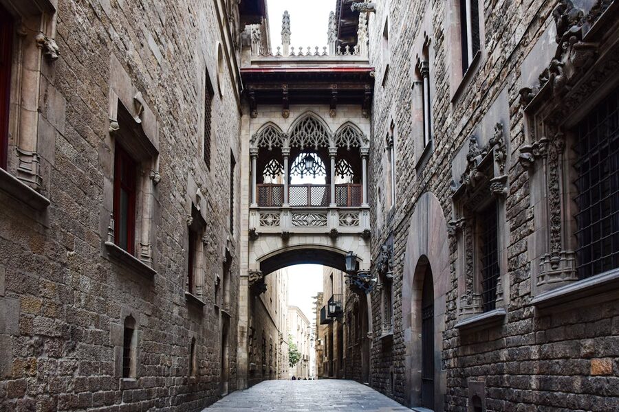 Historic Gothic archway in Barcelona with stone walls
