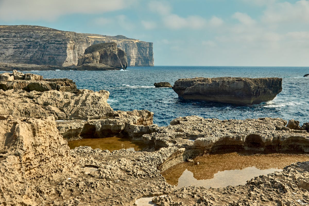 Rock formations and blue sea along the coast of Gozo Malta
