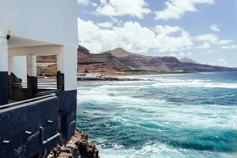 Dramatic coastal cliffs of Gran Canaria with waves crashing below