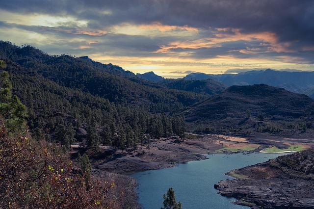Lush green valley surrounded by volcanic mountains in Gran Canaria