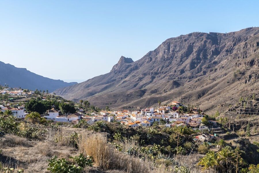 Small village at the base of mountains in a Gran Canaria valley