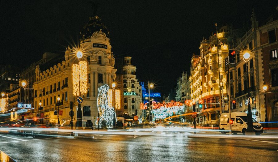 Gran Via in Madrid decorated with holiday lights at night