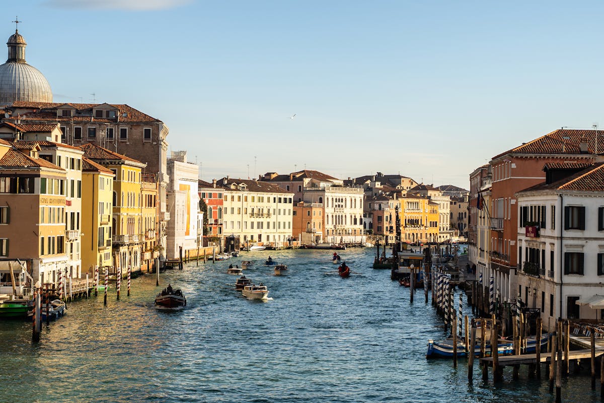 Grand Canal in Venice with traditional architecture and boats at sunset