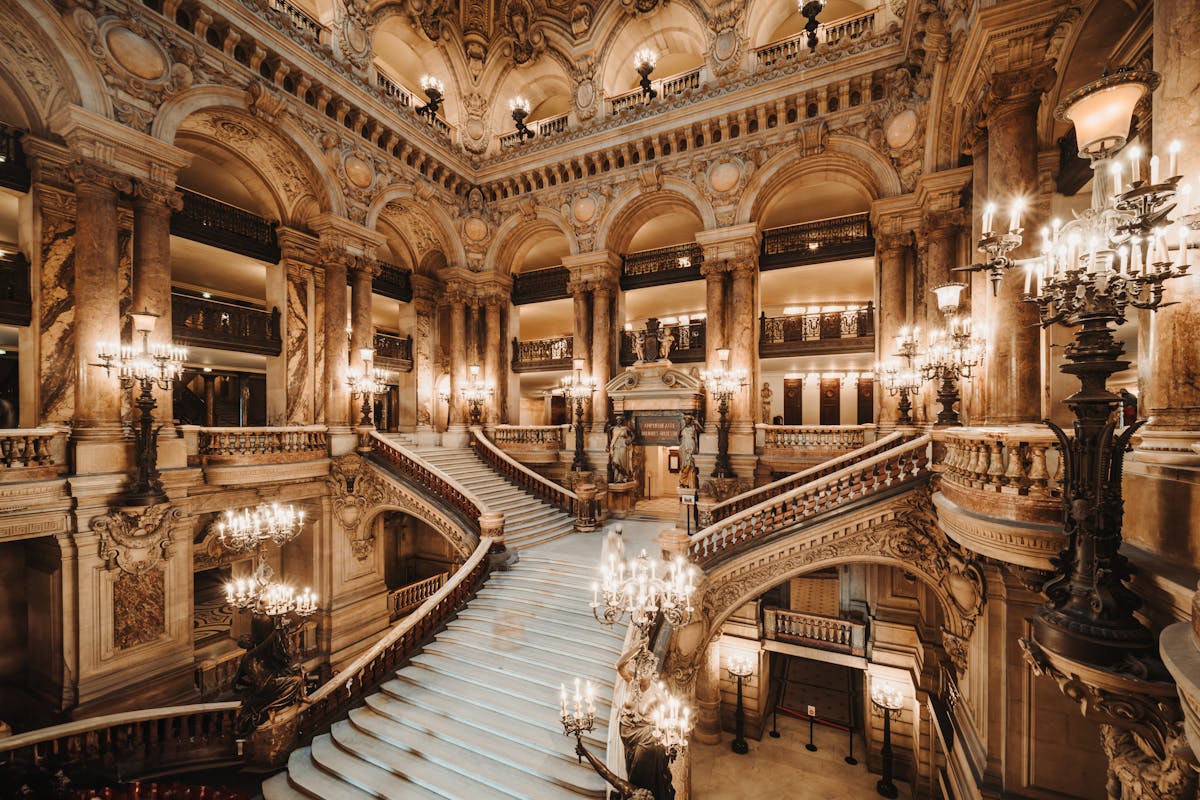 Interior view of the ornate marble Grand Staircase at the Opera Garnier in Paris