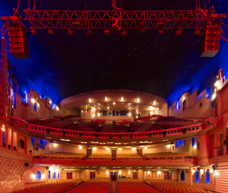 The main auditorium of Le Grand Rex cinema in Paris showing the atmospheric ceiling and Mediterranean village design