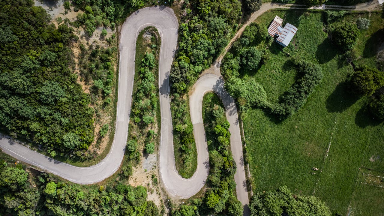 Winding road through the green Greek countryside in the Peloponnese
